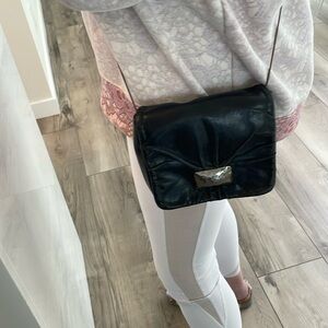 Michelle Fantaci, supple leather fully leather lined, 6inx7in.